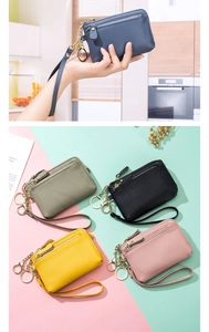 Litchi texture leather coin purses with wrist strap in various colors shown on a stylish set