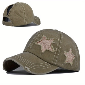 Detailed close-up of distressed army green baseball cap with sequin stars and ponytail hole
