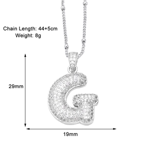 Detailed view of silver letter G pendant with cubic zirconia and size specifications