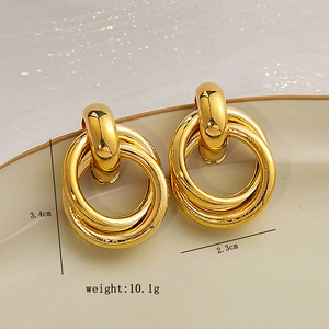 Detail view of gold geometric layered hoop earrings with dimensions 3.4cm by 2.3cm