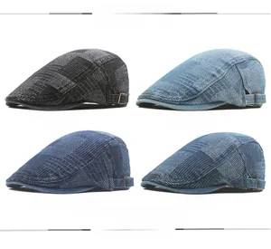 Close-up of vintage denim flat caps in four colors with adjustable metal side buckles