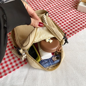 Mini beige canvas crossbody phone bag for women with adjustable strap and internal storage