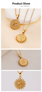 Detailed view of 18K gold plated stainless steel coin pendants with K and B letter engravings