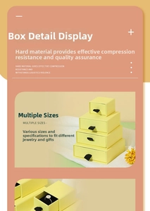 Detail of yellow jewelry drawer box with black ribbon pull and velvet insert