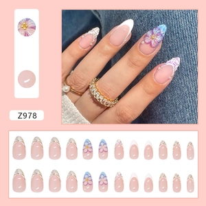 French almond press-on nails with 3D purple flowers, pearls and tweed texture patterns
