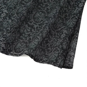 Deep grey shirt with vintage floral patterns and metallic texture on fabric hem