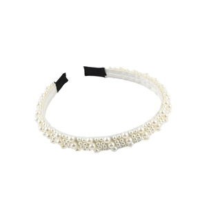 Elegant woven pearl headband with multiple rows of white round beads in a stylish design