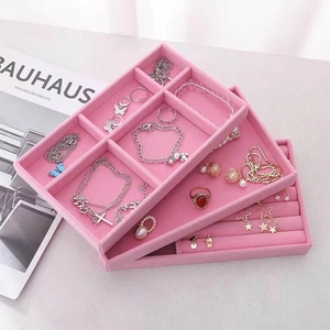 Pink velvet jewelry organizer tray with multi-grid compartments for rings and necklaces