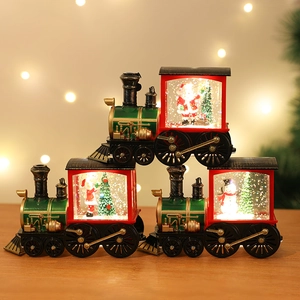 Vintage Christmas train water lantern with Santa and snowman scenes under warm LED lights