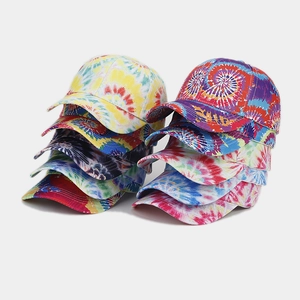 Detailed stack of vibrant tie-dye baseball caps showcasing various colorful patterns