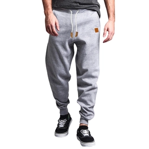 Close-up of gray joggers showing cotton fabric texture and adjustable drawstring waist
