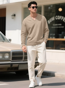 Close-up of khaki V-neck long sleeve knit sweater with textured cable knit pattern