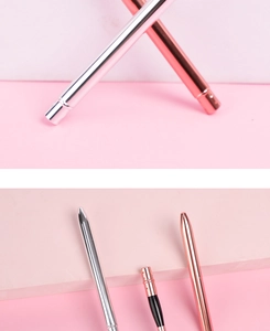 Detail of silver and rose gold metal makeup brush handles with glossy finish