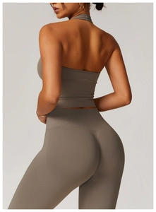 Rear view of high-waisted taupe yoga set showing seamless contouring and lifting effect