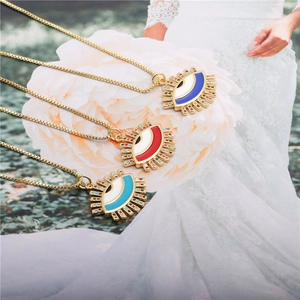 Three elegant evil eye pendant necklaces in red, blue, and light blue with cubic zirconia