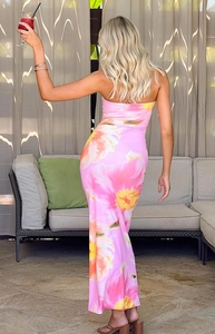 Back view of a slim-fit pink floral tube maxi dress with open back for summer vacations