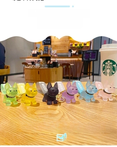 Macro view of crystal French Bulldog keychains in six matte translucent colors with straps