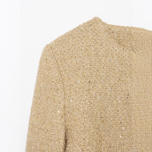 Elegant beige-gold tweed jacket with subtle sequins and textured metallic weave detail