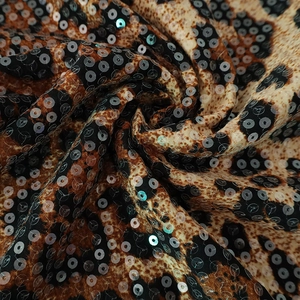 Detailed macro view of leopard print fabric with shimmering sequins and animal texture