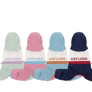 Waterproof multi-color hooded dog raincoats in mint green, pink, and blue colorblock