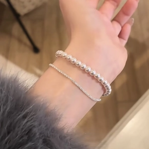 Elegant double-layer rose zircon and pearl bracelet set for women on model wrist