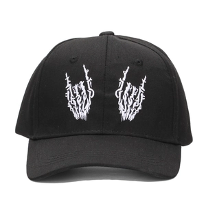 Black cotton baseball cap featuring white skull hand rock gesture embroidery detail