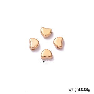 Set of four 6mm golden heart-shaped CCB beads for DIY jewelry making on white background