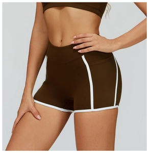 Close-up of high-waist fitness shorts with contrast white piping and tummy control