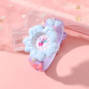 Close-up of children's blue flower watch with purple strap and pink butterfly decor
