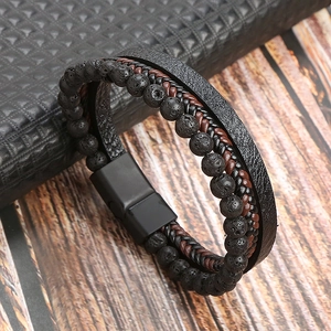 Detail of multi-layer leather bracelet with volcanic stone beads and metal clasp