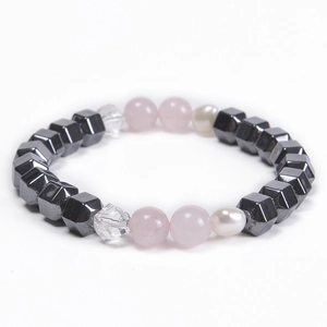 Macro shot of 8mm pink crystal beads, freshwater pearl and hematite beaded bracelet