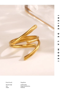 Detail of minimalist multi-layer gold wire wrap ring with adjustable open structure