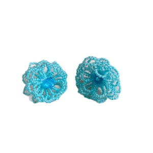 Handmade light blue beaded flower stud earrings with crystal center on a white background