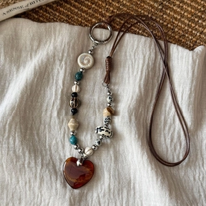 Vintage bohemian heart pendant necklace with colorful ceramic beads and brown woven rope