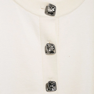 Cream knit cardigan for women featuring unique silver flower-shaped textured buttons