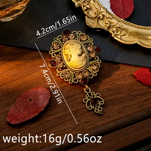 Detail view of vintage relief brooch showing precise dimensions 7.4cm by 4.2cm on wood