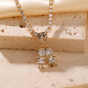 Gold hip-hop necklace featuring heart pendant and two girls with sparkling crystals