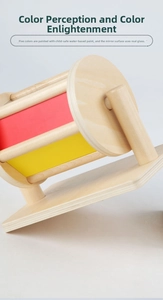Detail of wooden spinning drum toy with five colors, water-based paint, and a real mirror