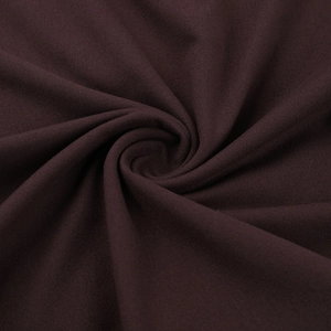 Macro shot of dark brown knitted fabric texture with spiral pattern for sleek slim-fit set