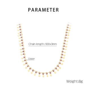 Detail view of a gold-plated copper necklace featuring purple beads and waterdrop pendant