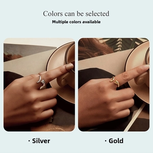 Detail view of fox-shaped adjustable open rings in polished silver and gold finishes
