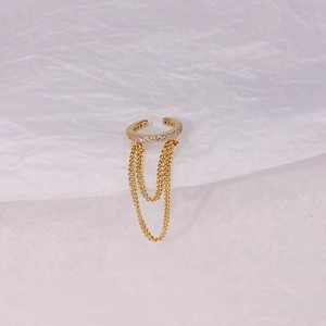 Detail of gold double chain tassel ear cuff with sparkling pavé crystal accents