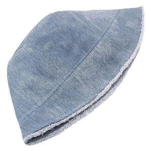 Close-up of frayed edges and twill texture on a washed blue denim bucket hat detail