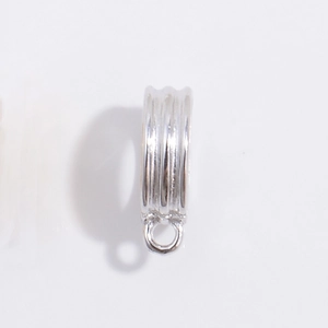Macro detail of silver S925 bail clasp accessory with connecting loop for jewelry