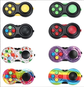 Multiple fidget pad styles including colorful galaxy, rainbow, and solid color buttons