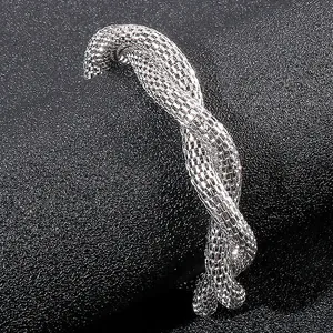 Minimalist silver braided mesh bracelet in twisted stainless steel with metallic luster