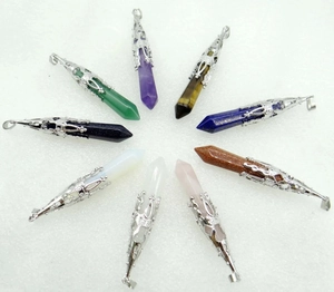 Detailed overhead view of multiple hexagonal natural crystal stone pillar pendants