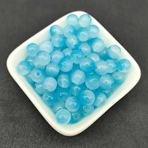 Macro shot of 8mm gradient blue translucent glass beads for DIY jewelry making