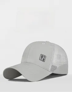 Detail of light gray mesh baseball cap showing breathable stitching and square patch