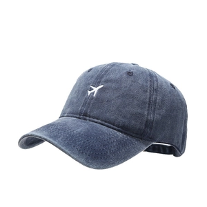 Navy blue baseball cap with airplane embroidery and retro washed cotton texture